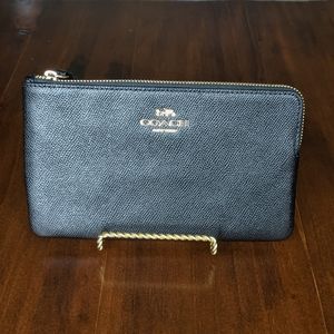 Coach large corner zip wristlet - black.